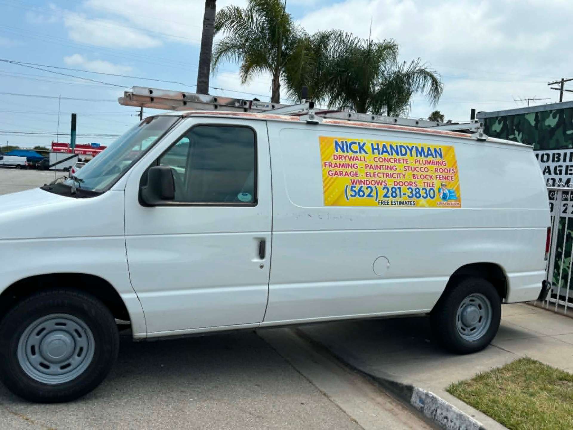 Nick Handyman service van listing trades and phone number